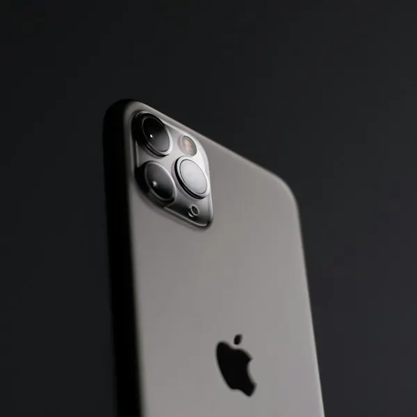 The back of an iPhone with a triple camera